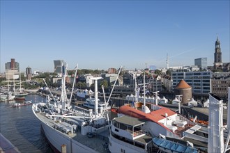 View of the Landungsbruecken and the museum ship Cap San Diego at the Ueberseebruecke in the Port of Hamburg from a cruise ship