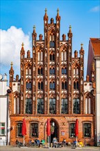 Gabled house in brick Gothic style on the historic market square