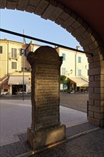 Memorial stone to the translator Domizio Calderini
