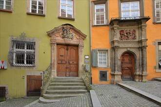 Green Stellwaghaus with staircase and orange Renaissance Widmanhaus