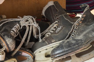 Vintage men's ice skates for sale inside second hand goods and chattels store