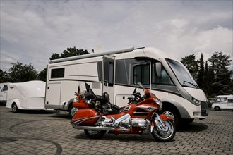 Motorhome with motorbike trailer