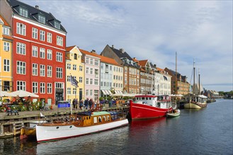 Nyhavn with colourful houses and boats in the centre