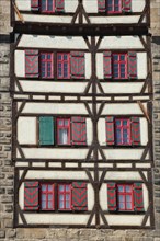 House wall of the Gothic Schelztor built in 1228 with shutters and half-timbering