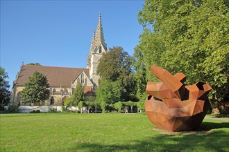 Sculpture The Cold Heart by Stefan Strumbel 2015 and late Gothic Oberhofen Church built 1490