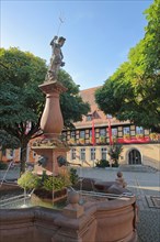 Neptune Fountain with Sculpture and Half-half-timbered house House Savings Bank