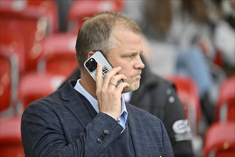 Sports director Fabian Wohlgemuth VfB Stuttgart on mobile phone