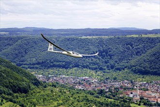 Glider flying over Unterlenningen in the Swabian Alb
