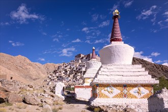 Stupas in front of Chemrey Gompa