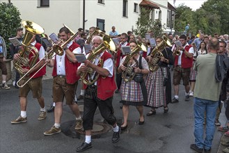 Brass band marches through the village on the day of the traditional Tanzlindenfest