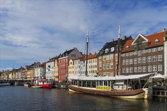 Nyhavn with colourful houses and boats in the centre