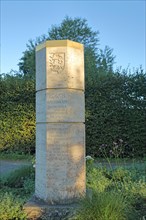 Staufer stele with Baden-Wuerttemberg coat of arms and inscription at the monastery