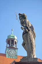 Sculpture Neptune with trident and spire of the town hall