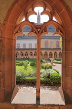 View through window to the inner courtyard with cloister of the Augustinian monastery built 15th century
