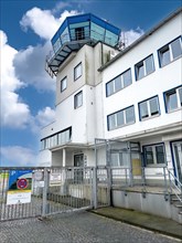 View from public ground on tower of airport airfield Essen Muelheim built on rest of historical building from 30s of 20th century