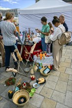 Visitors and ceramic figures at the pottery and handicraft market
