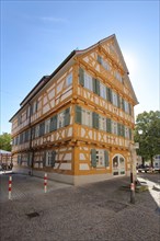 Yellow half-timbered house former German school