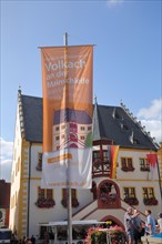 Flag with inscription Mainschleife and people