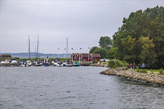 Jetty at Rune's Lighthouse with typical Swedish boathouses