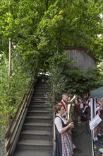 Brass band at the stairway to the dance lime tree at the traditional dance lime tree festival in Limmersdorf