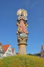Madonna figure from the Marienbrunnen with flower decoration