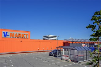 Orange facade and parking spaces