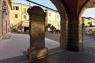Memorial stone to the translator Domizio Calderini