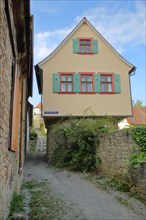 Narrow half-timbered house on the historic town wall
