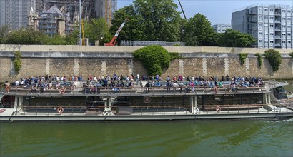 Excursion boat with tourists on the Seine