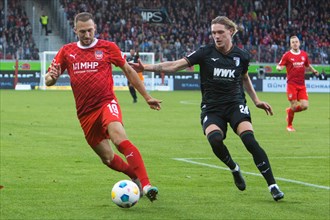 Jonas FOEHRENBACH 1.FC Heidenheim left in duel with Hans Fredrik JENSEN FC Augsburg