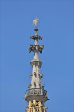 Spire of the Gothic Church of Our Lady built in 1321 with golden angel as weather vane