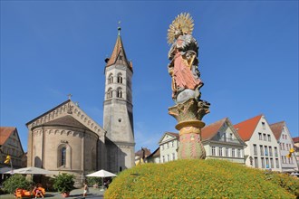 Neo-Romanesque St. John's Church and market fountain with Madonna figure