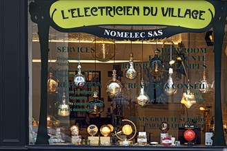 Shop window with modern lamps and ceiling lights