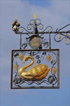 Golden nose sign of the restaurant swan