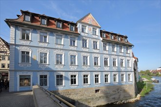 Blue Heller House with ornamentation and stucco on the Regnitz River