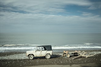 Jeep with trailer on Black Sea beach