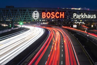 A8 motorway at Stuttgart Airport with Bosch multi-storey car park. The 440-metre-long structure provides space for 4200 vehicles. Bosch has the naming rights