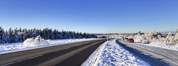 Snow-covered landscape and Black Forest High Road in winter near Baiersbronn