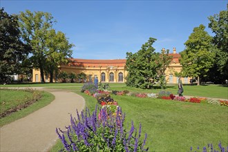 Castle garden with flowerbed and baroque orangery