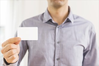 Close up businessman showing blank white visiting card