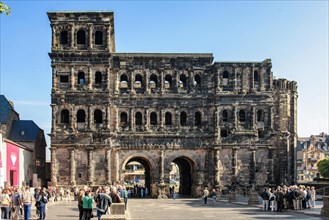 Perspective corrected photo of city side view looking at historic ancient Roman city gate Porta Nigra in Trier