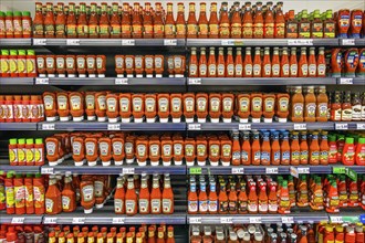 Shelves with tomato ketchup