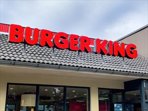 Red lettering Burger King in red over restaurant Schnellrestaurant fuer Fastfood by Fastfoodkette