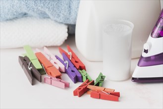 Close up detergent cup with pegs