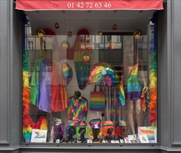 Shop window with colourful hats and clothes