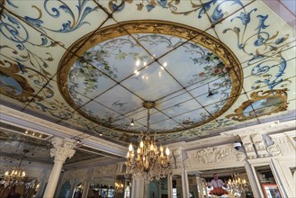 Ceiling with stained glass in a traditional French bakery and patisserie