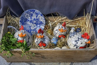 Funny ceramic chickens at the pottery and handicraft market