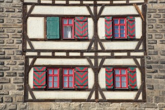 House wall of the Gothic Schelztor built 1228 with shutters and half-timbering