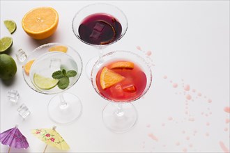 High angle cocktail glasses with salt rim lime