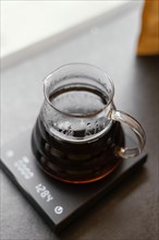 High angle jug with coffee scale coffee shop